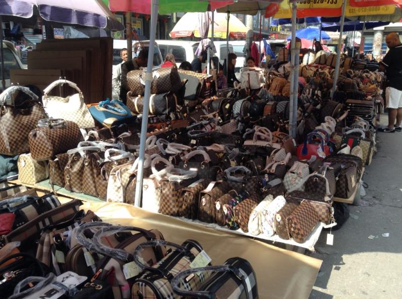 Handbag Shops selling copied handbags on both sides of the street in Zi Yuan Gang-